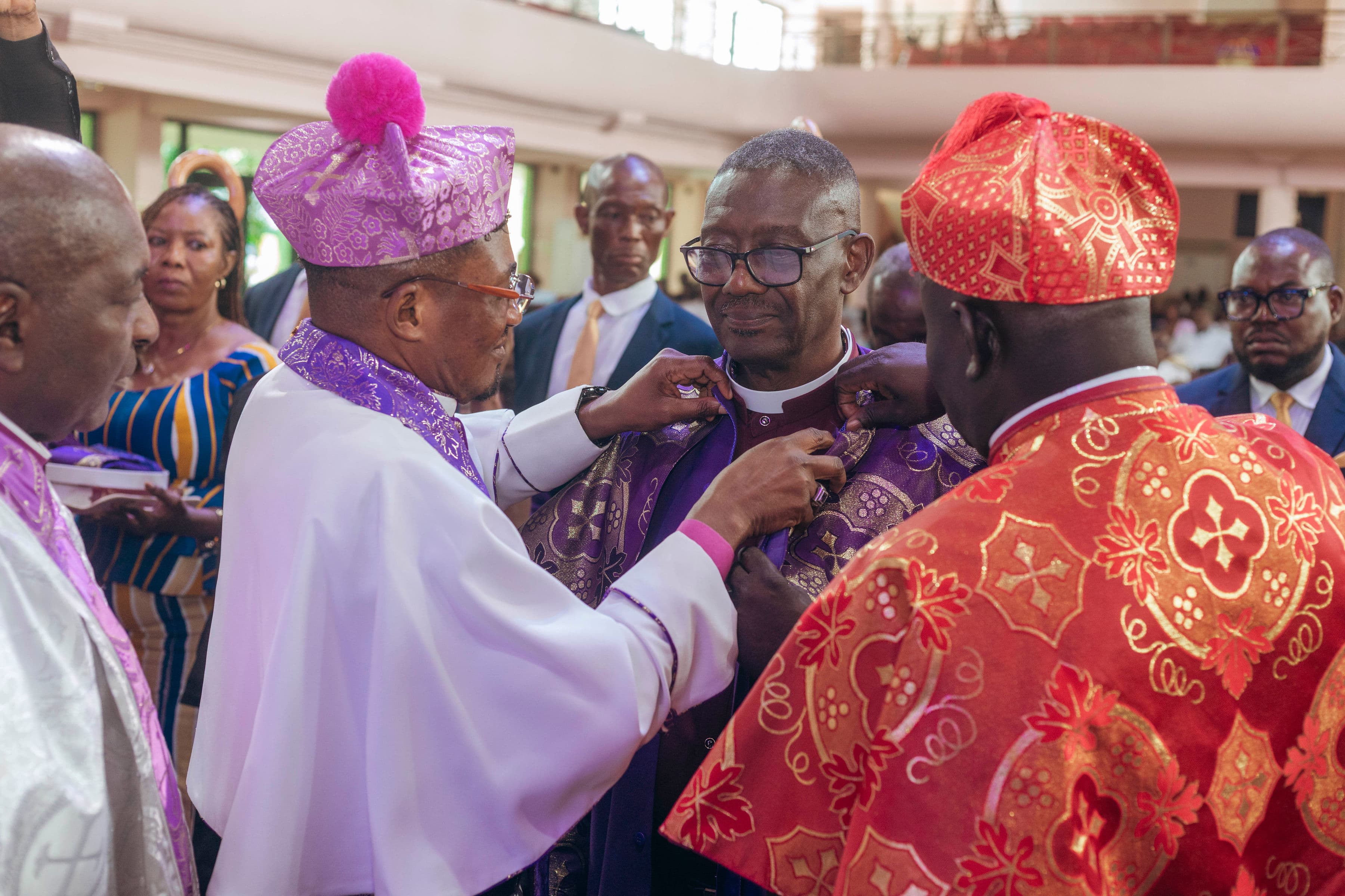 Rev. Thompson Sakyi being vested during his Apostolic Consecration